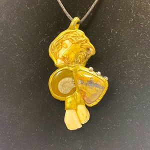 Susan Sorrentino “Beast” necklace. Ammonite fossil, agate, elk teeth. 2 faces.